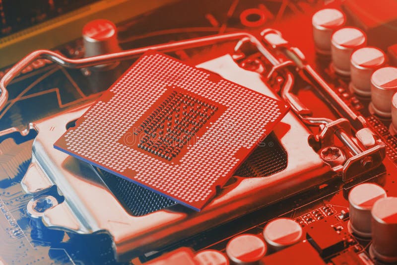 The Central Processor on the Computer Motherboard in Red Colors Stock