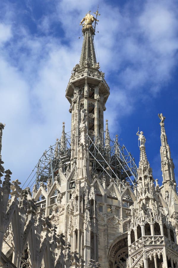 The central spire of a cathedral Duomo, Milan