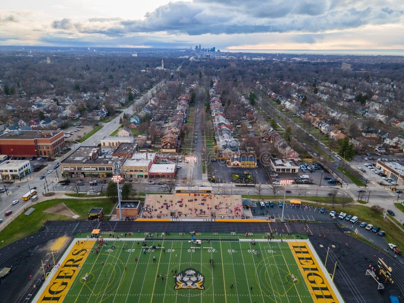 Shot while overlooking the Cleveland Heights high school stadium, the houses, streets and spring trees line up, pointing to downtown Cleveland in the far distance. It's cloudy, with a storm brewing. There is a track event happening at the stadium. Shot while overlooking the Cleveland Heights high school stadium, the houses, streets and spring trees line up, pointing to downtown Cleveland in the far distance. It's cloudy, with a storm brewing. There is a track event happening at the stadium.