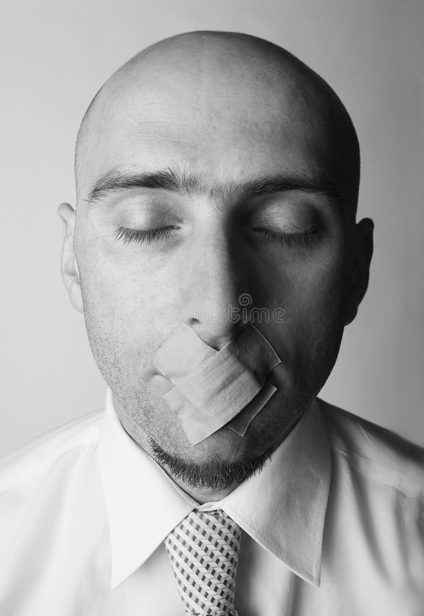 Young man with closed eyes and badges over his mouth, black and white. Young man with closed eyes and badges over his mouth, black and white