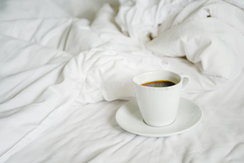 https://thumbs.dreamstime.com/b/ceramic-cup-hot-black-coffee-messy-bed-sheet-soft-focus-white-150943579.jpg