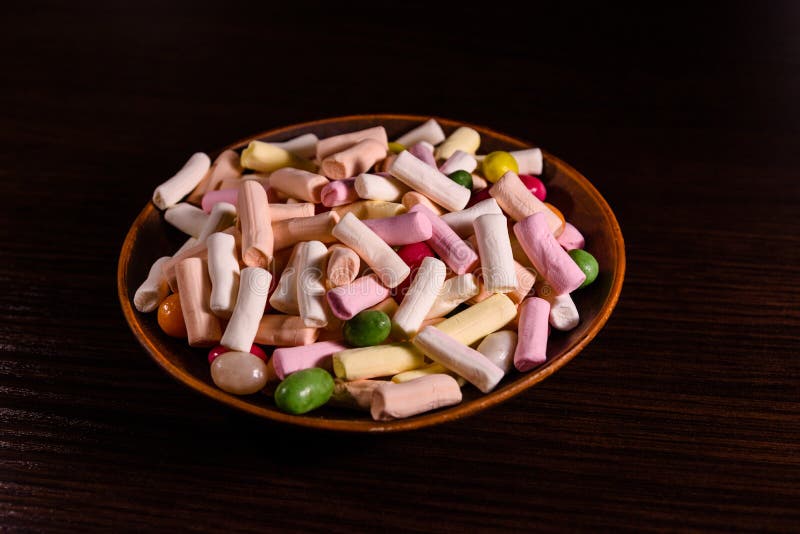 Ceramic Dish with the Different Multi Colored Candies on a Dark Stock
