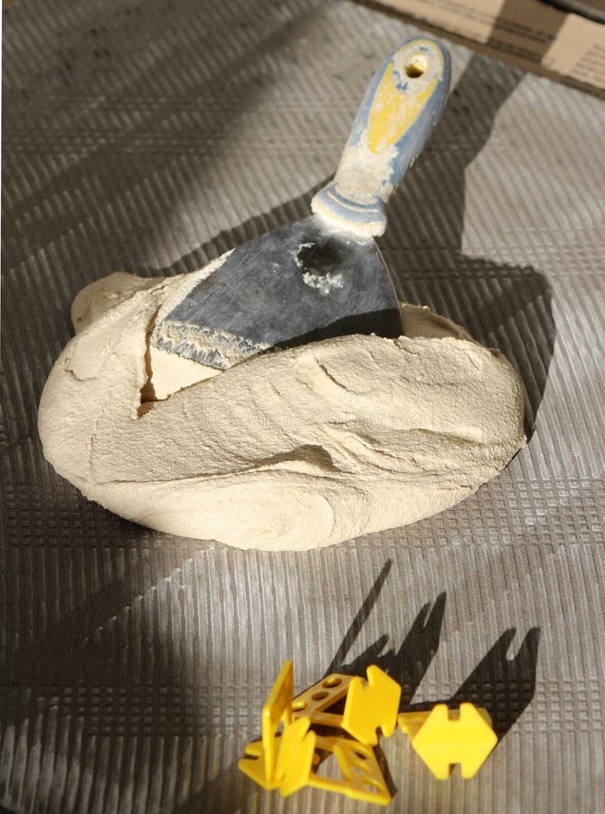 Ceramic Glue or Cement with the Trowel on Ceramic Tile. Stock Photo