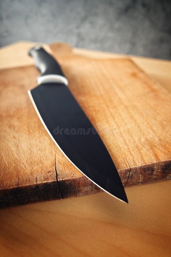 Professional chef knife, peeling knife and sharpening steel on wood cutting  board over a kitchen table. Chef working tools. Modern kitchen utensils  Stock Photo - Alamy