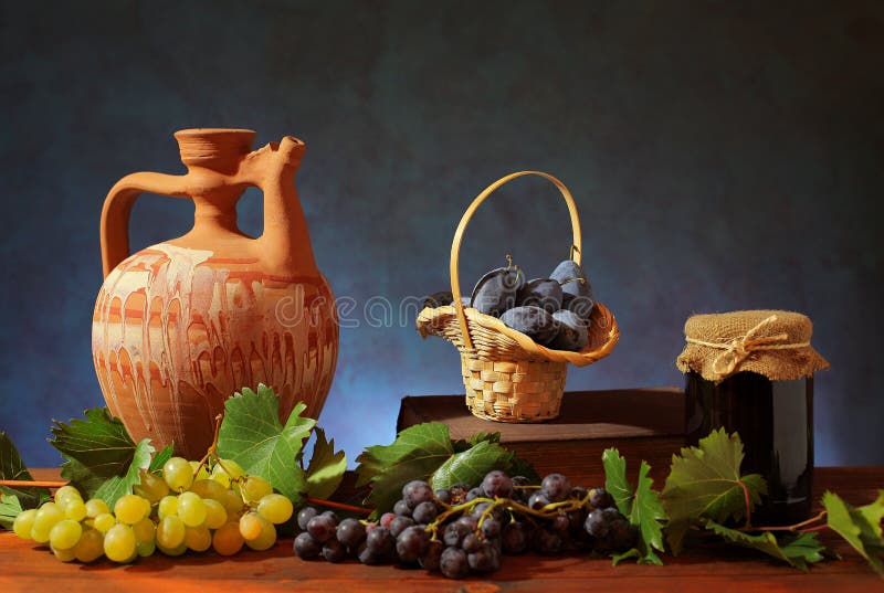Ceramic pitcher and plums