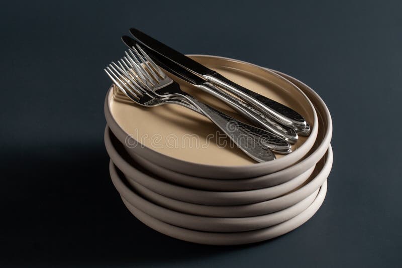 Ceramic Plates, Forks and Knives on Black Table Stock Image Image of