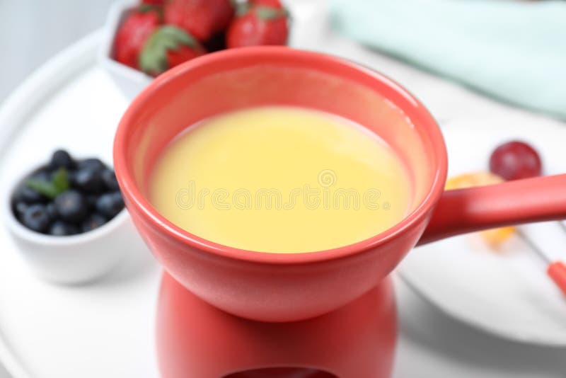 Ceramic Pot With White Chocolate Fondue On Table Stock Image Image of