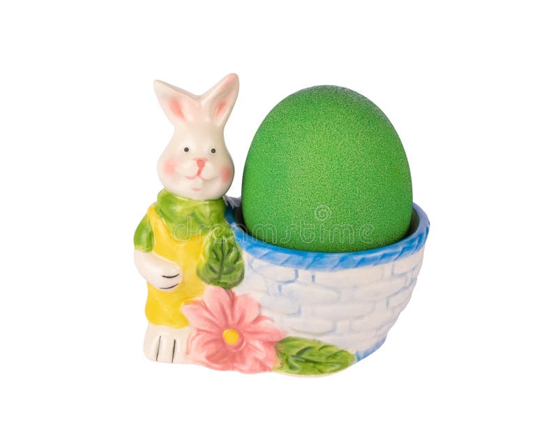Ceramic Rabbit Figurine Eggcup with Green Painted Egg Stock Image