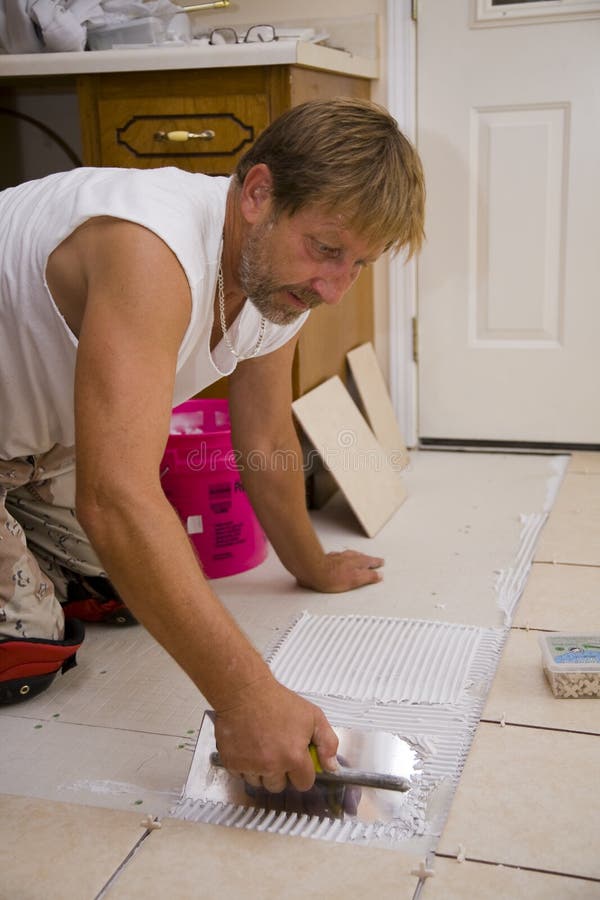 Ceramic tile installer stock photo. Image of ceramic, mastic 6284046
