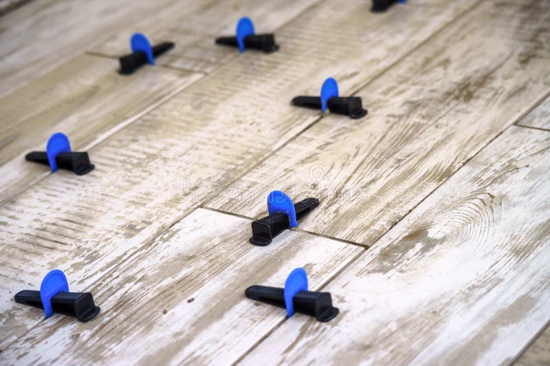 Ceramic Tile Leveling System. Apparatus for Laying Stoneware Tiles