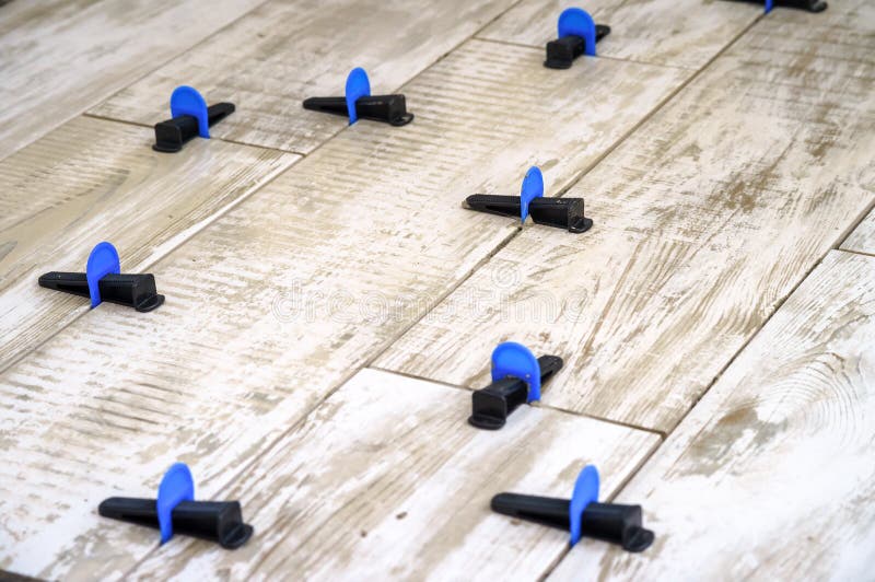 Ceramic Tile Leveling System. Apparatus for Laying Stoneware Tiles