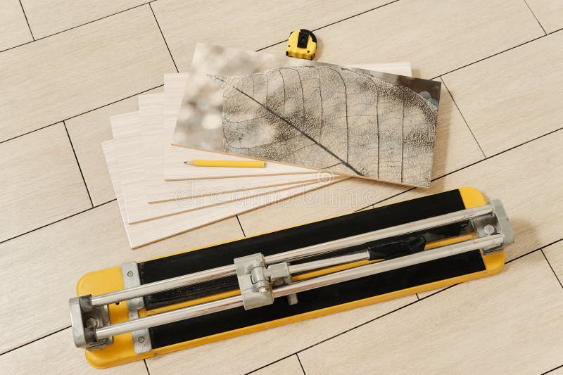 Ceramic Tile, Manual Cutter, Measuring Tape and Pencil Stock Image