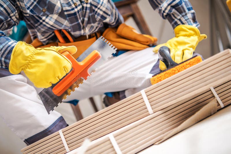 Ceramic Tiles Installer stock image. Image of installer 119358605