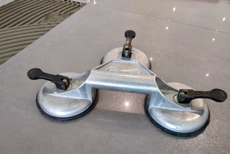 Ceramic Tiles and Tools for Tiler. Floor Tiles Installation Stock Photo