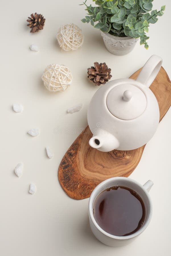Ceramic White Teapot with Accessories on a Wooden Table, Horizontal Frame, Tea Time, Tea