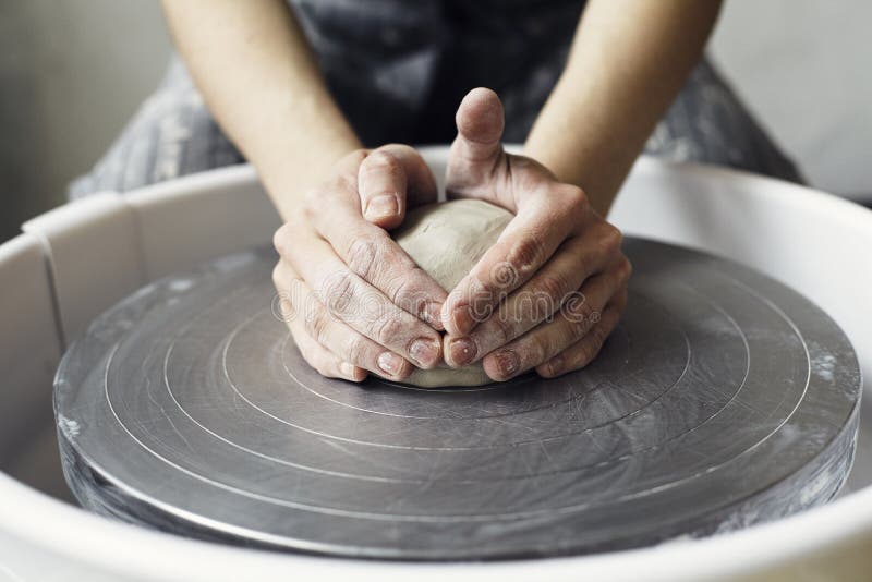 Ceramic working process with clay potter`s wheel. royalty free stock photo