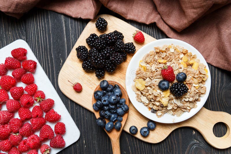 Cereal. Breakfast with muesli and berries. Top view, flat lay