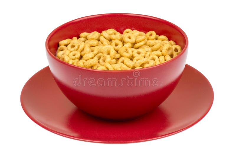 Cereal entero de los cheerios del grano en el cuenco rojo fotografía de archivo libre de regalías Cereal entero de los cheerios del grano en el cuenco rojo fotografía de archivo libre de regalías