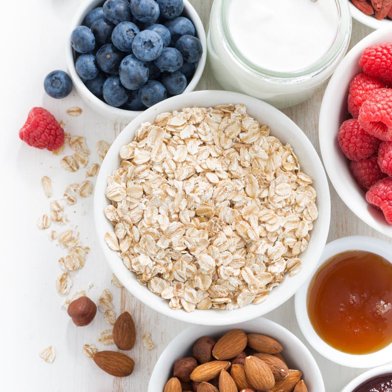 Cereal and various delicious ingredients for breakfast, top view