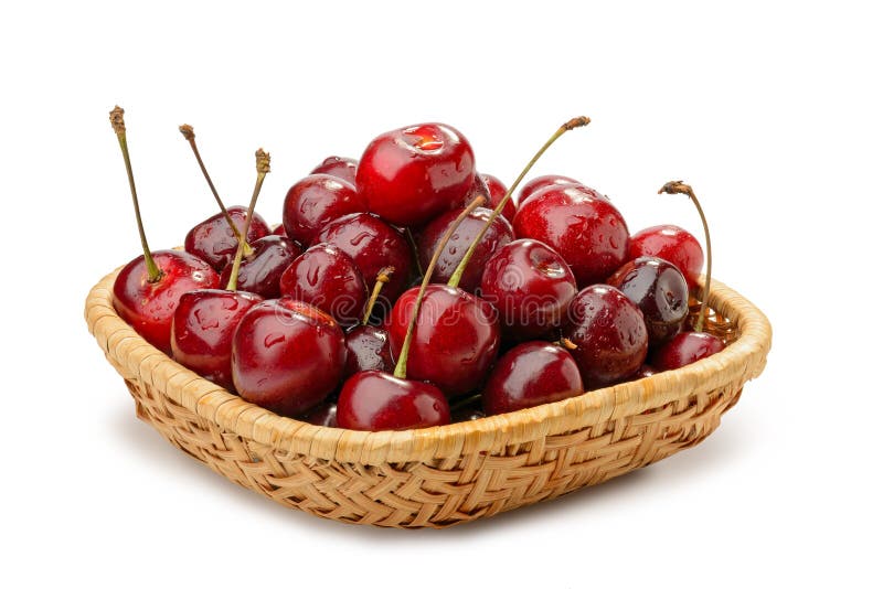 Cerejas em uma cesta fotografia de stock Cerejas em uma cesta fotografia de stock