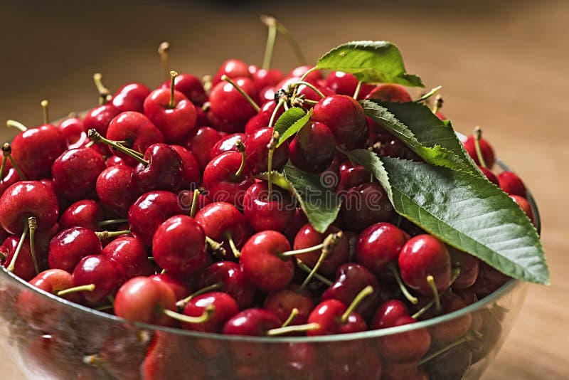 Tasty red cherries in glass bowl. Tasty red cherries in glass bowl