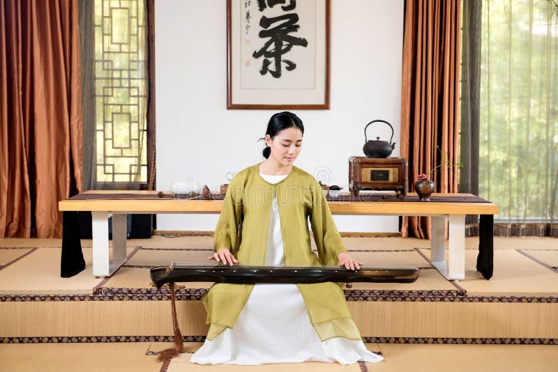 China woman show China tea ceremony in classical Chinese teahouse. China woman show China tea ceremony in classical Chinese teahouse