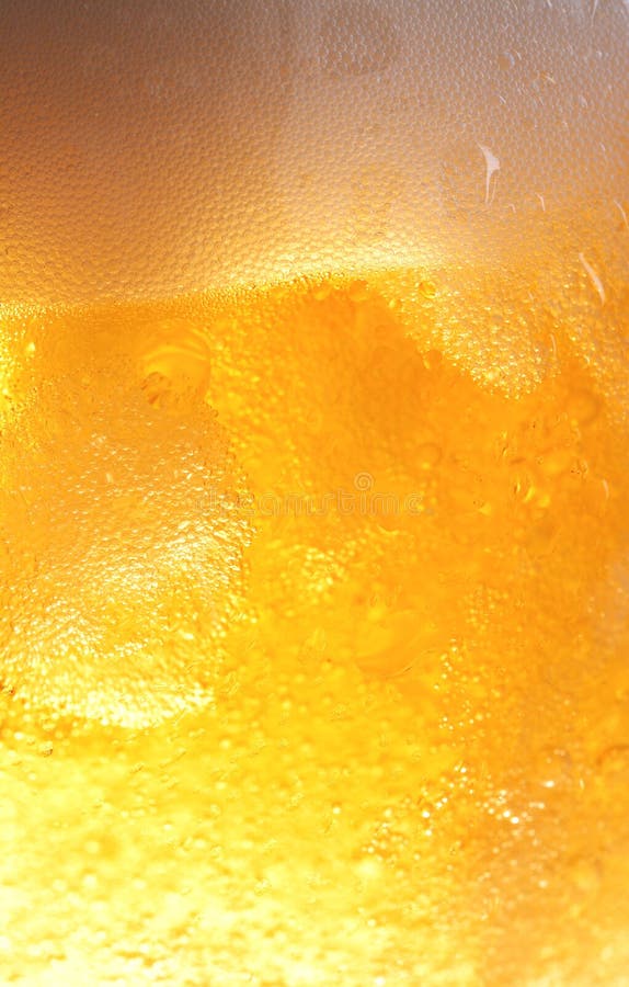 Bubbles in beer and droplets outside the glass. Bubbles in beer and droplets outside the glass.