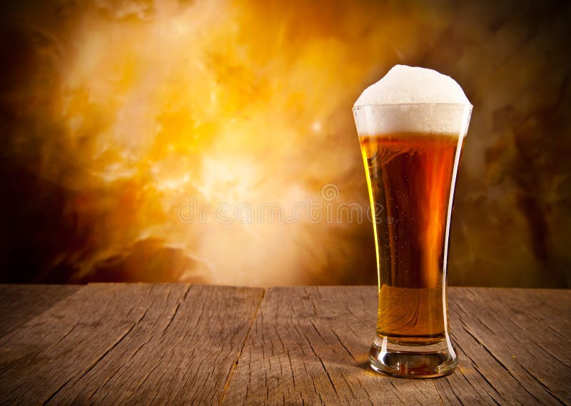 Glass of beer on wooden table. Glass of beer on wooden table