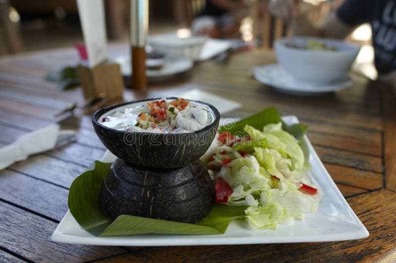 Ceviche with raw fish in coconut milk