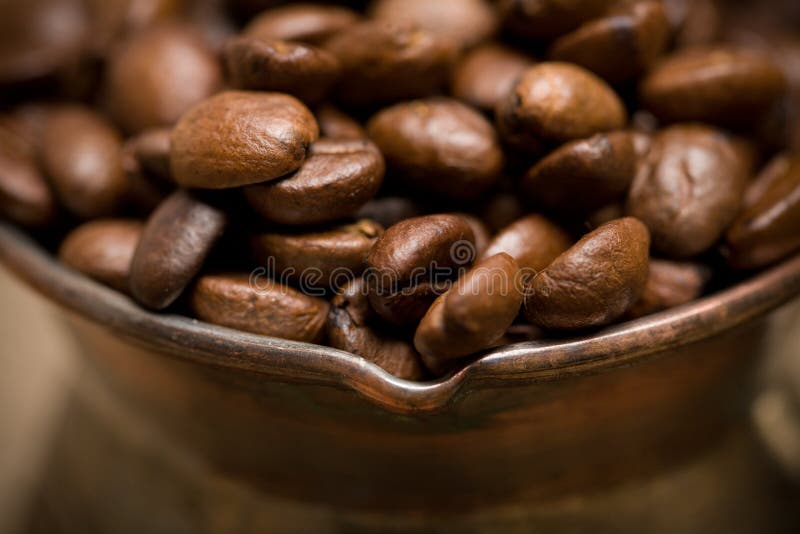 Cezve with freshly roasted coffee beans