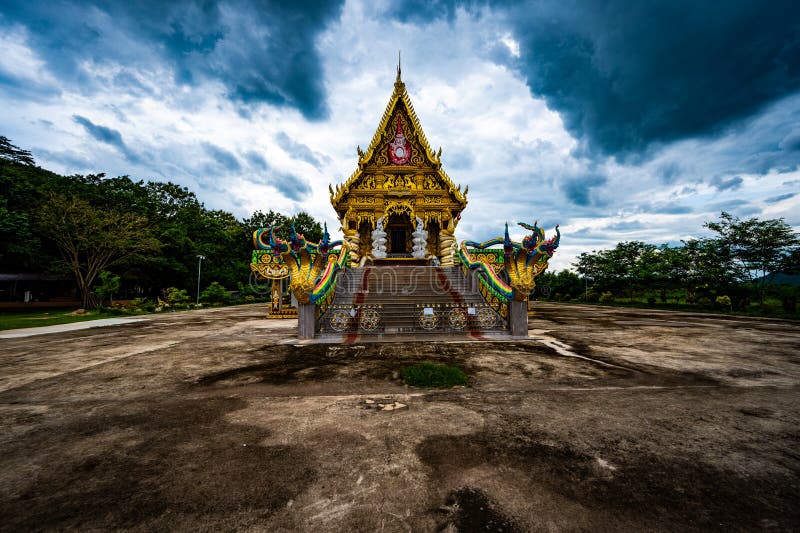 Chachoengsao, Thailand, 28 July 2023. Traditional Thai temple adorned with intricate designs and golden embellishments. Two stock photo