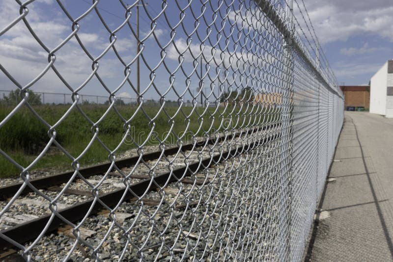 Chain Link Mesh Fence in Front of Railway Track Stock Photo Image of