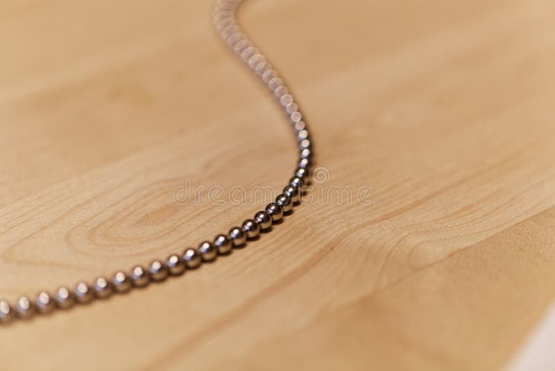 Chain of small steel balls stock image. Image of 108626319