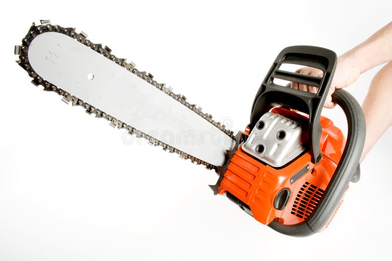 Holding a very heavy orange chainsaw