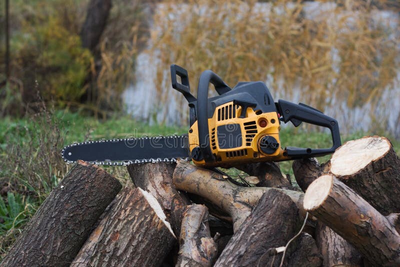 Yellow chainsaw stock photo. Image of yellow, work, white 17509412