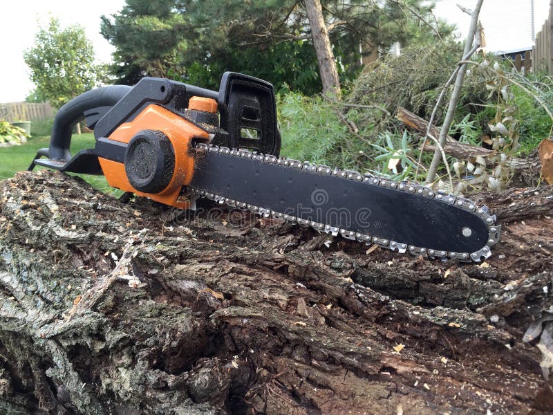Chainsaw work stock image. Image of green, chainsaw, black 58042485