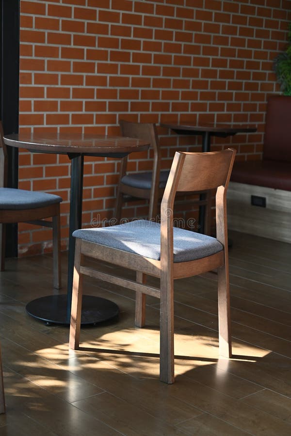 A chair in a coffee shop stock image. Image of plant 266169401