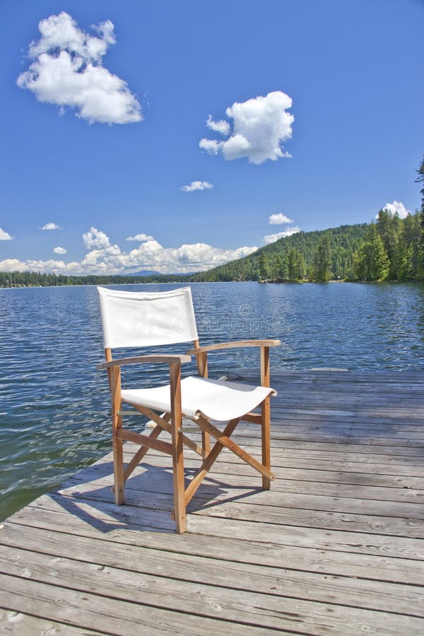 A Chair on the Dock of a Beautiful Lake Stock Photo Image of summer