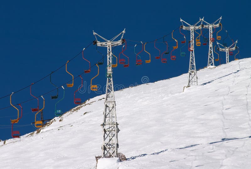 Chair lift in blue sky