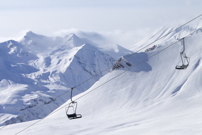 Chair lift at ski resort stock image. Image of capped 25156601