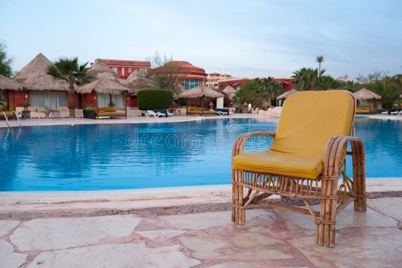 Chair near the pool stock photo. Image of horizontal 30763390