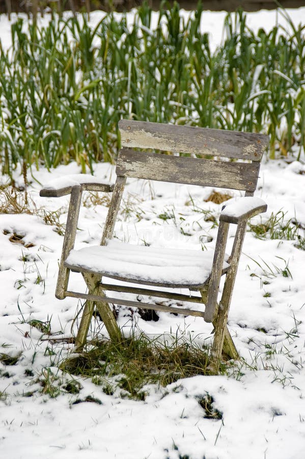 Chair in the snowy vegetable garden