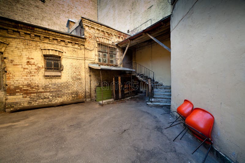 Series Chairs Against Red Wall Stock Photos Free & RoyaltyFree Stock