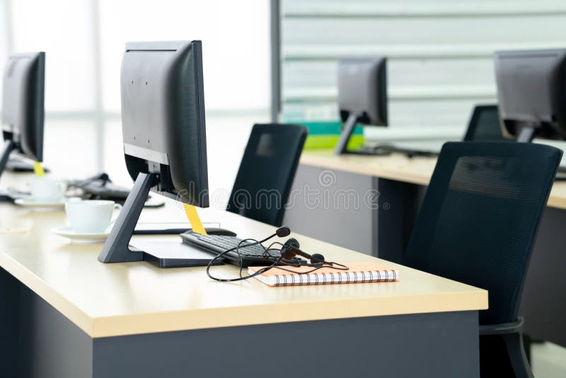 Chairs Computers and Headset Call Center in Modern Office Stock Image