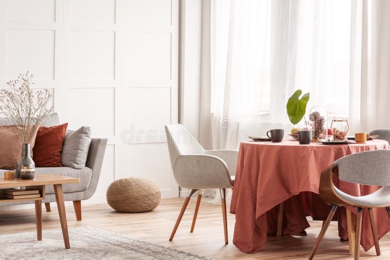 Chairs at Dining Room Table Set for Easter Family Meeting Stock Photo
