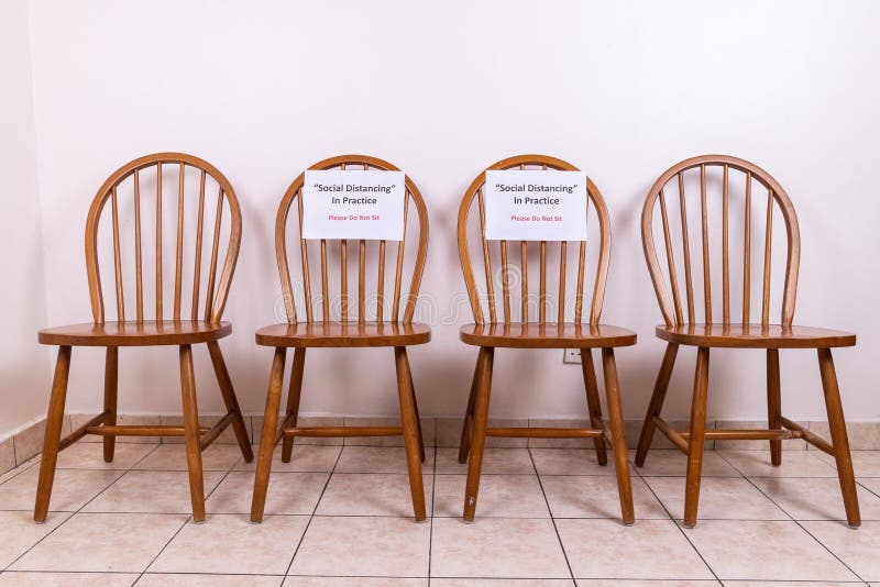 Chairs with Social Distancing & Do Not Sit sign, to discourage close proximity between people to contain Covid-19