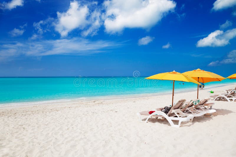 Chairs & yellow umbrellas on Grace Bay Beach stock image Chairs & yellow umbrellas on Grace Bay Beach stock image