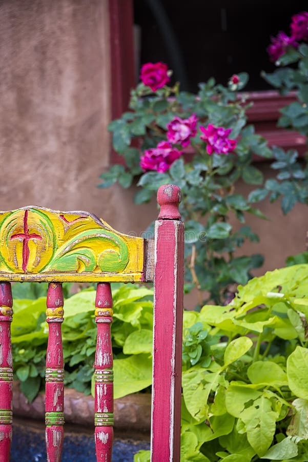 Colorful old chair sitting outside on Canyon Road in Santa Fe, NM. Colorful old chair sitting outside on Canyon Road in Santa Fe, NM