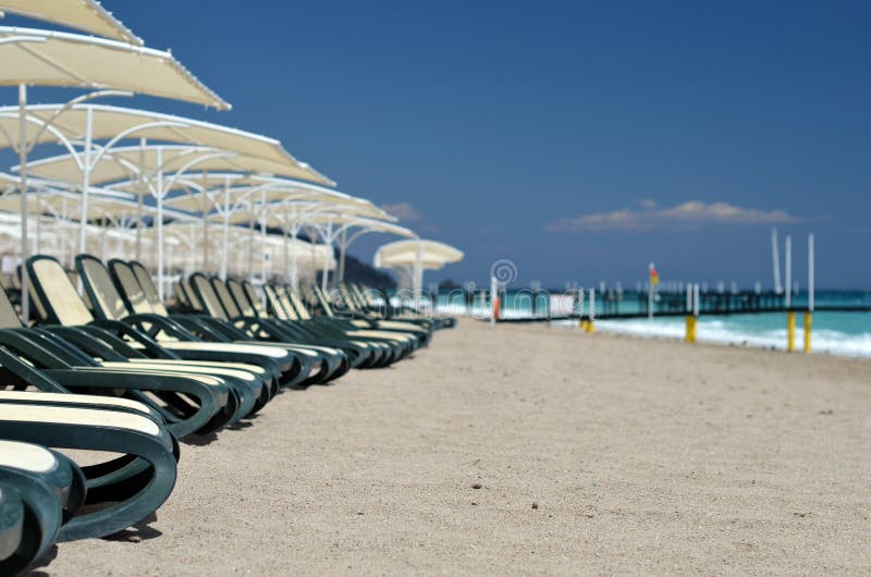 Chaise longue beach stock image. Image of resort, bright 92230425