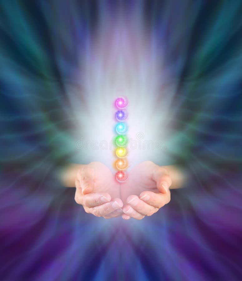 Chakra Healer. Healer's hands emerging from feather like multicolored energy formation background, cupped with seven chakra vortexes hovering above in a misty royalty free stock image Chakra Healer. Healer's hands emerging from feather like multicolored energy formation background, cupped with seven chakra vortexes hovering above in a misty royalty free stock image